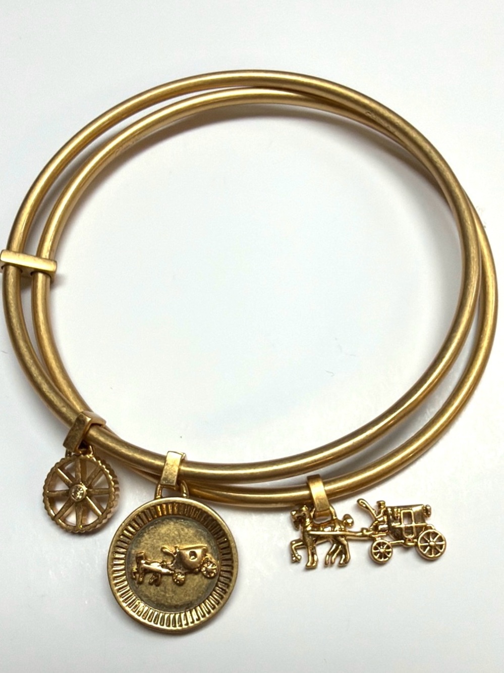 Coach Gold Tone Double Bangle Bracelet with Carriage Charms